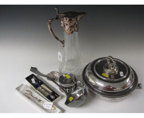 An Art Nouveau plated mounted glass Claret Jug, Vegetable Dish with beaded rim, Mustard Pot, Pickle Fork, Gravy Spoon, Soup L