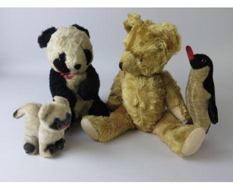 A gold fully jointed Teddy Bear probably Chiltern, 16in H, a seated Ting-a-Ling panda, Merrythought penguin and a kitten (4)