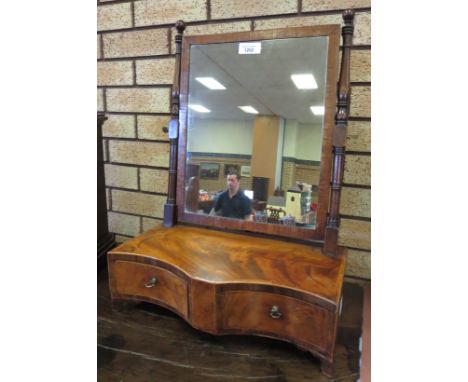 A late Georgian mahogany Dressing Mirror with rectangular base on cross-banded serpentine base fitted two drawers on bracket 