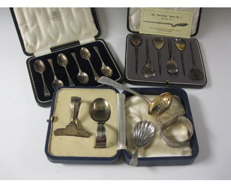 Two Sets of six silver Teaspoons and a Spoon and Pusher, cased, a Georgian silver bright-cut Caddy Spoon with shell bowl, sil