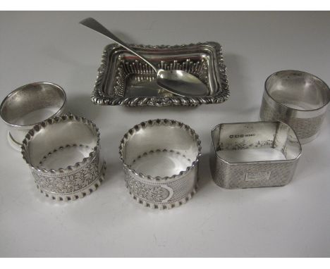 A Victorian silver oblong Trinket Dish, Chester 1895, five various Napkin Rings, Teaspoon and plated Spirit Flask