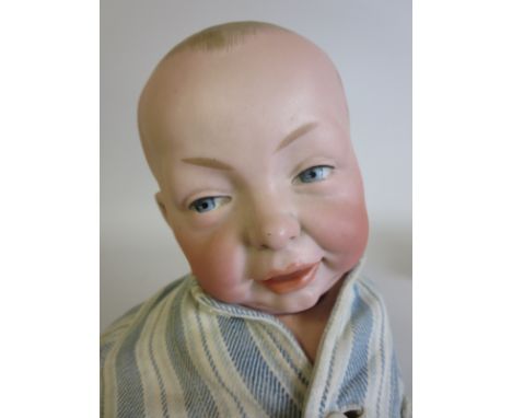 A Kammer and Reinhardt character Kaiser baby Doll with painted eyes, five piece baby body with bent arm. Impressed K & R 36 1