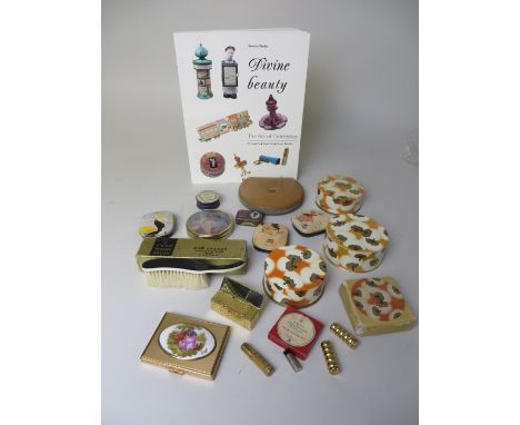 A group of four Coty Lalique-designed unopened boxes of Powder, tins of soap with fashionable printed tops, Elizabeth Arden c