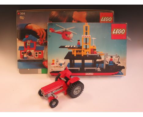 A boxed Logo No. 364 Dock Set, a boxed No. 373 Oil Rig Set, a quantity of unboxed complete Sets including a completed Tractor