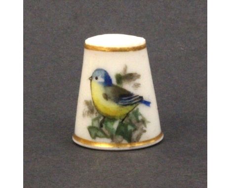 A Royal Worcester porcelain puce mark thimble painted with a blue tit and ivy leaves, unsigned