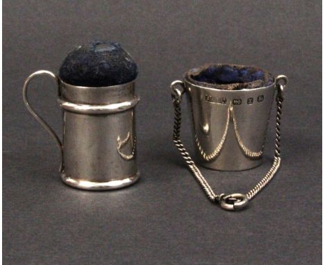 A silver pin cushion and a thimble bucket, the pin cushion as a muffinier, Birmingham, 1902 by Henry Williamson Ltd., 3.4cm, 