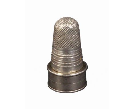 A rare Georgian combination silver thimble, the circular base fitted as a vinaigrette with gilded grill, the thimble with mul