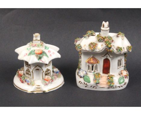 Two 19th Century Staffordshire ceramic pastille burners each modelled as a cottage with flowers, the circular example restore
