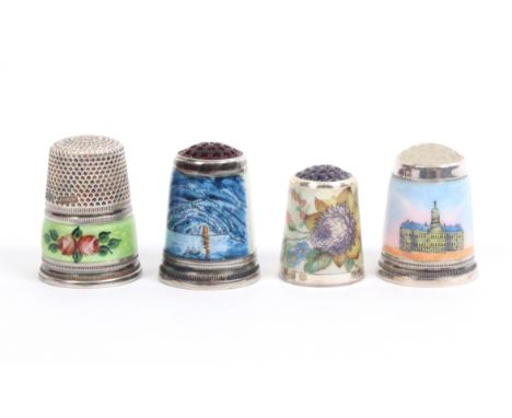 Four enamel decorated thimbles comprising a white metal example with green ground floral border, stamped 'Sterling-Germany', 