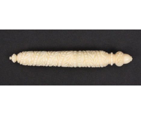 A 19th Century ivory needle case of cylinder form spiral carved with leaves, acorn finial, 10.2cm