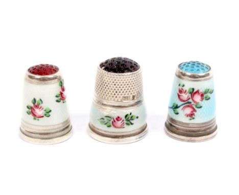 Three pretty white metal and floral enamel thimbles each with inset stone top, all stamped '925'  (3)