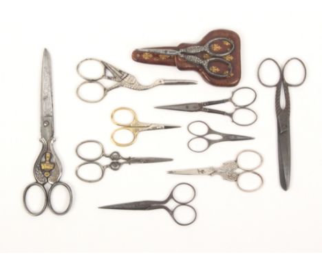 Ten pairs of scissors, including a steel pair inscribed to one blade 'Souvenir of Ohliys' the arms divided by a brass portrai