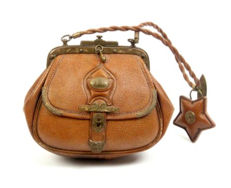A mid 19th Century brown leather bag form sewing companion for a child, engraved gilt brass clasp and mounts, the front pouch