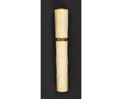 An 18th Century ivory bodkin case of cylinder form with engine turned decoration, gilt metal scroll ferrule, split to top, 10