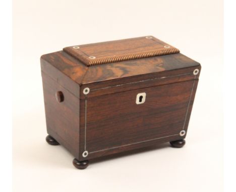 A mid Victorian rosewood sarcophagal form tea caddy with mother of pearl dots and pewter lines, lacking ring handles, on bun 
