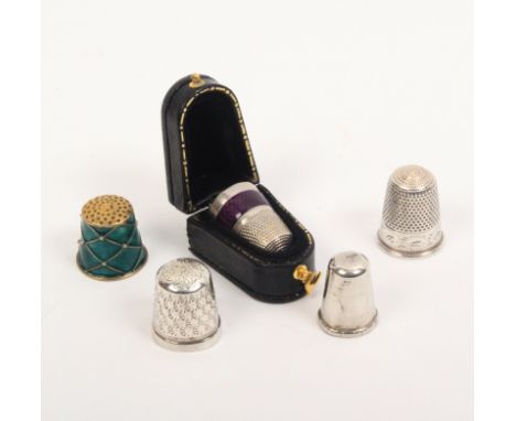 Five thimbles comprising a silver thimble with purple enamel band in leather case, and four others one in green enamel  (5)