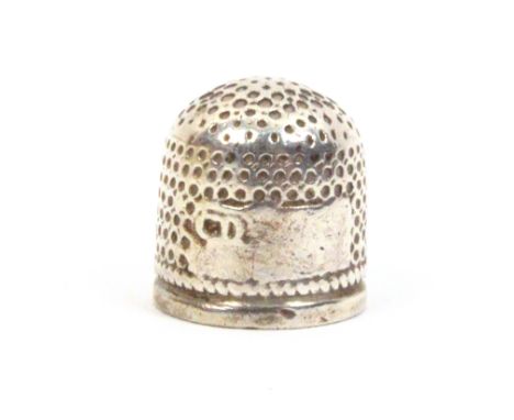 A 17th Century English silver thimble, the vacant rectangular cartouche with a makers mark, probably CD