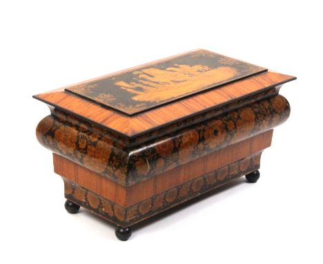 A fine Regency penwork tea caddy of ogee rectangular form, the stepped sides with twin bands of flowering branches and leaves