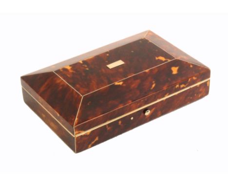 A tortoiseshell etui of rectangular form, circa 1840, with a full compliment of tools, the curved lid with pewter lines and c