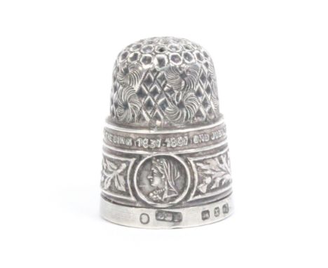 A silver commemorative thimble, Queen Victoria's diamond jubilee 1897, two neat holes to apex, Birmingham, 1897, by Deakin an
