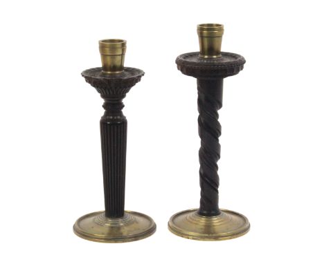 A 'pair' of ornamentally engine turned hardwood candlesticks, the stems of variant design, brass bases and sconces, scratch e