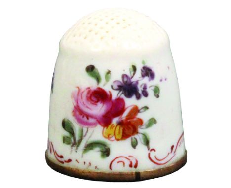 A rare English 18th Century enamel thimble of small size probably for a child, copper gilt rim, decorated with three groups o
