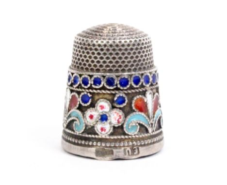 An early 20th Century Russian silver and cloisonnŽ enamel thimble, the frieze enamelled with coloured dots and scroll motifs,