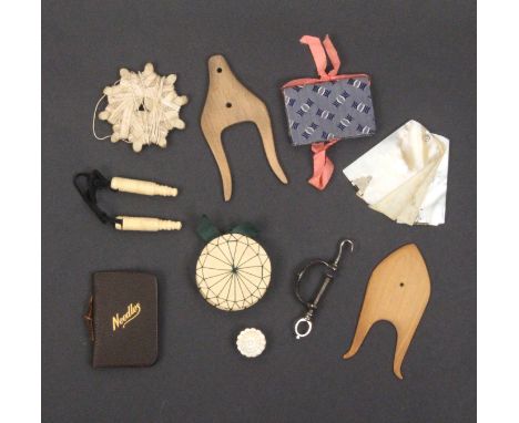 A mixed lot - sewing - comprising a rectangular leatherette cased set, some tools probably matched, 14cm, a red leather skein