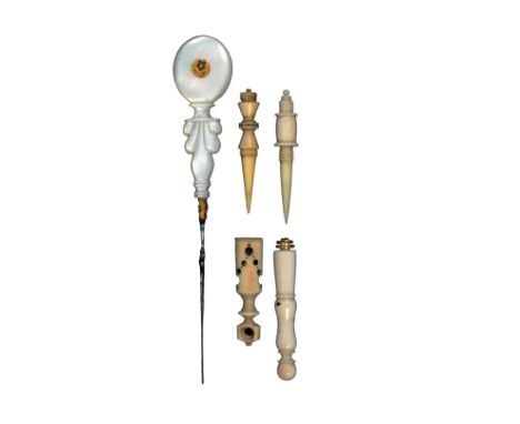 A Palais Royal stiletto and two others, the first with gilt mount, the carved pearl handle inset with circular enamel pansy m