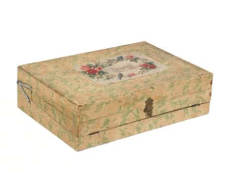 An unusual French rectangular sewing box for a child, in printed floral material the lid with a floral and bird print titled 