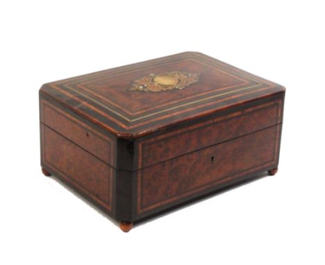 A French amboyna and inlaid musical sewing box, circa 1870, of rectangular form with canted corners, the cushion form lid wit