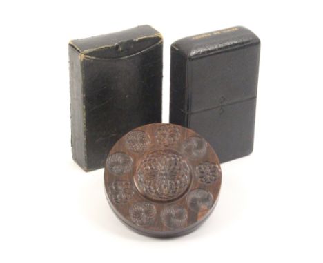 Three small boxes comprising a circular hardwood example with engine turned decoration in variant patterns, 9cm, a rectangula