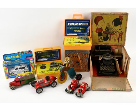 A small collection of tinplate and clockwork toys including ; Mar toys monkey cyclist, boxed, German toy type writer, boxed, 