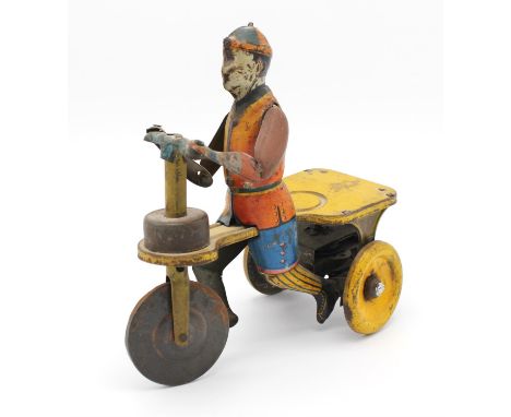 A  Behrend & Rothschild tinplate clockwork tricycle, 'Kid Flyer', polychrome painted with automated steering.  15.5cm highCon