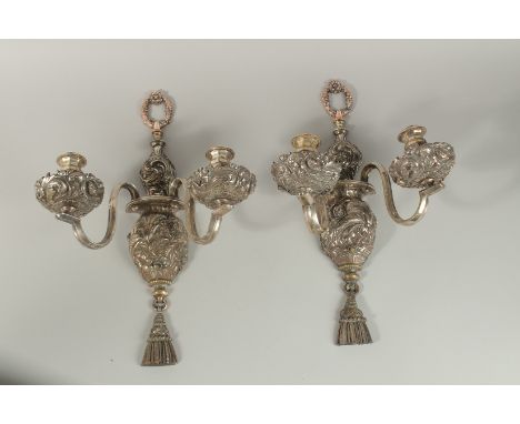 A GOOD PAIR OF OLD SHEFFIELD PLATE, TWO LIGHT WALL SCONES repousse with scrolls and acanthus. 47cm high.