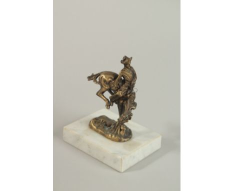A BRONZE RODEO HORSE AND RIDER CAR MASCOT. Signed, 10cm high.