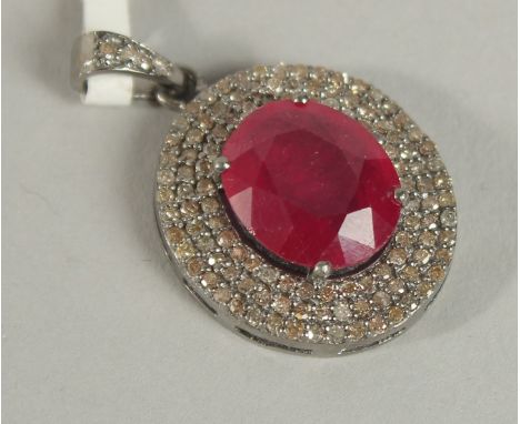 A GOOD DIAMOND AND RUBY PENDANT.
