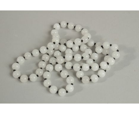 A GOOD STRING OF SEVENTY TWO WHITE JADE BEADS. 70cm long.
