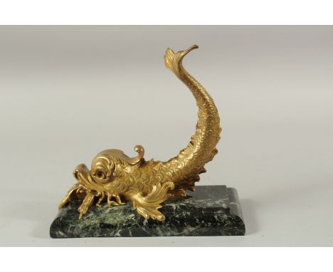 A GOOD GILT BRONZE DOLPHIN on a rectangular marble base. 25cms long x 24cms high.