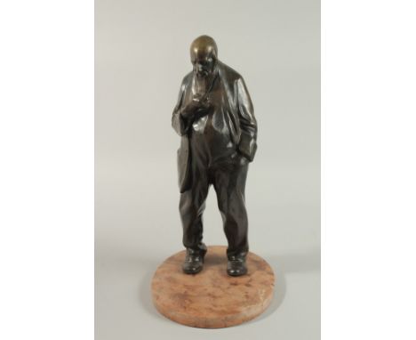 A BRONZE OF AN OLD BEADED MAN on a base. 34cm high.