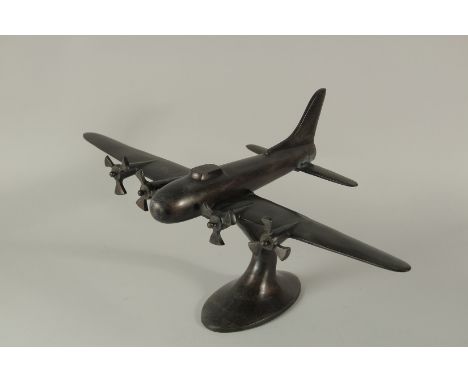 A BRONZE MODEL AEROPLANE. 22cms high.