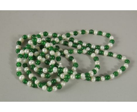 A STRING OF JADE AND PEARL BEADS. 120cms long.