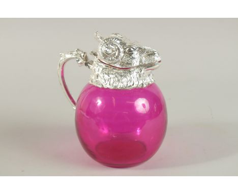 A GOOD RUBY GLASS NOVELTY CLARET JUG with ram's head, silver plated head and handle. 18cm high.