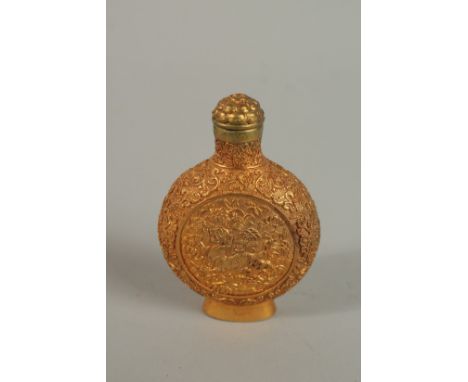 A CHINSES GILT BRONZE SNUFF BOTTLE. 8cm high.