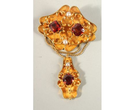 A VICTORIAN 18CT GOLD GARNET AND PEARL INSET BROOCH.