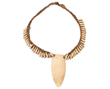 TRIBAL ART: A SHELL AND MARINE IVORY NECKLACE, probably South Seas, with woven cord, together with a Navajo bone necklace wit