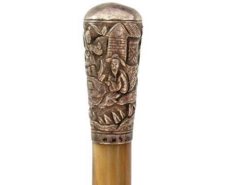 A LATE 19TH CENTURY RHINOCEROS HORN SWAGGER STICK, 83.5cm tapering body, insect damage, the white metal top well decorated wi