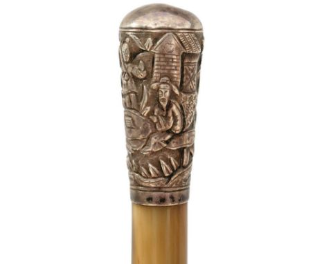 A LATE 19TH CENTURY RHINOCEROS HORN SWAGGER STICK, 83.5cm tapering body, insect damage, the white metal top well decorated wi