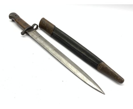 British Lee Metford bayonet stamped with various marks including EDF, with wooden mounted grip and leather scabbard, 43cm lon