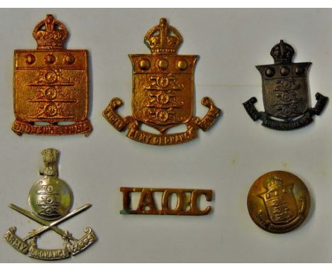 Indian Ordnance Corps cap badges (4) with a shoulder title and button. Includes: WWI and WWII Indian ordnance corps cap badge